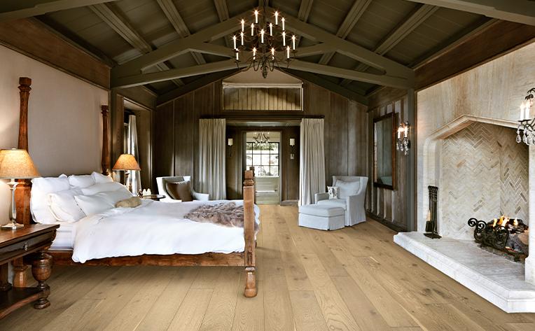 rustic hardwood flooring in a farmhouse bedroom